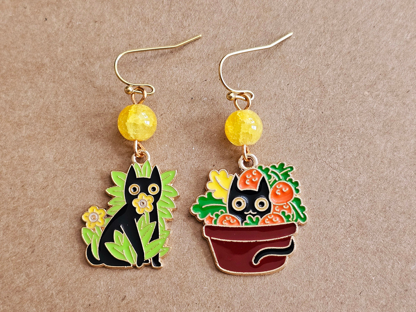 Beaded cat earrings with green, yellow and red flowers and fruits