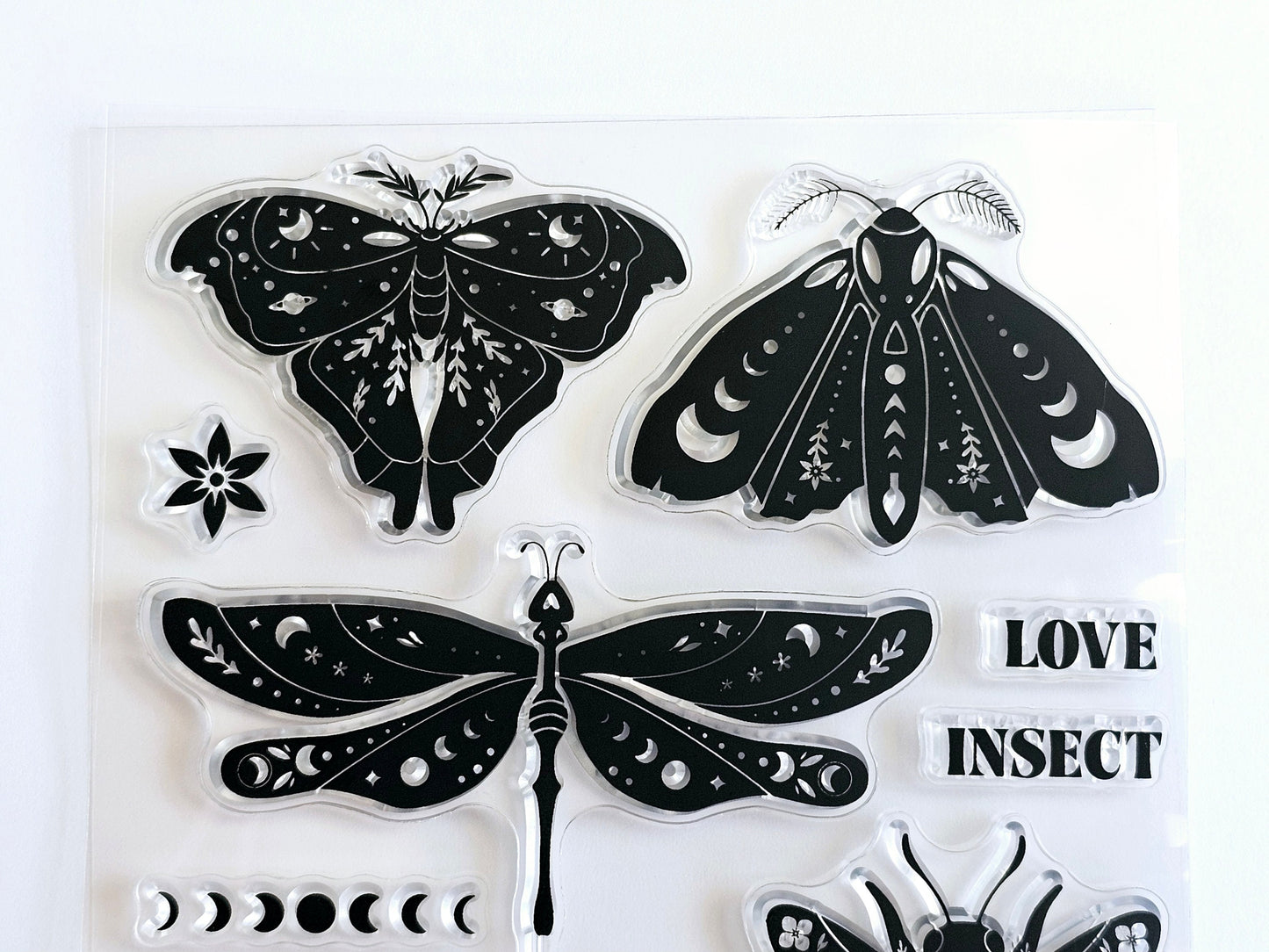 Moth stamps dragonfly stamps phases of the moon stamp.