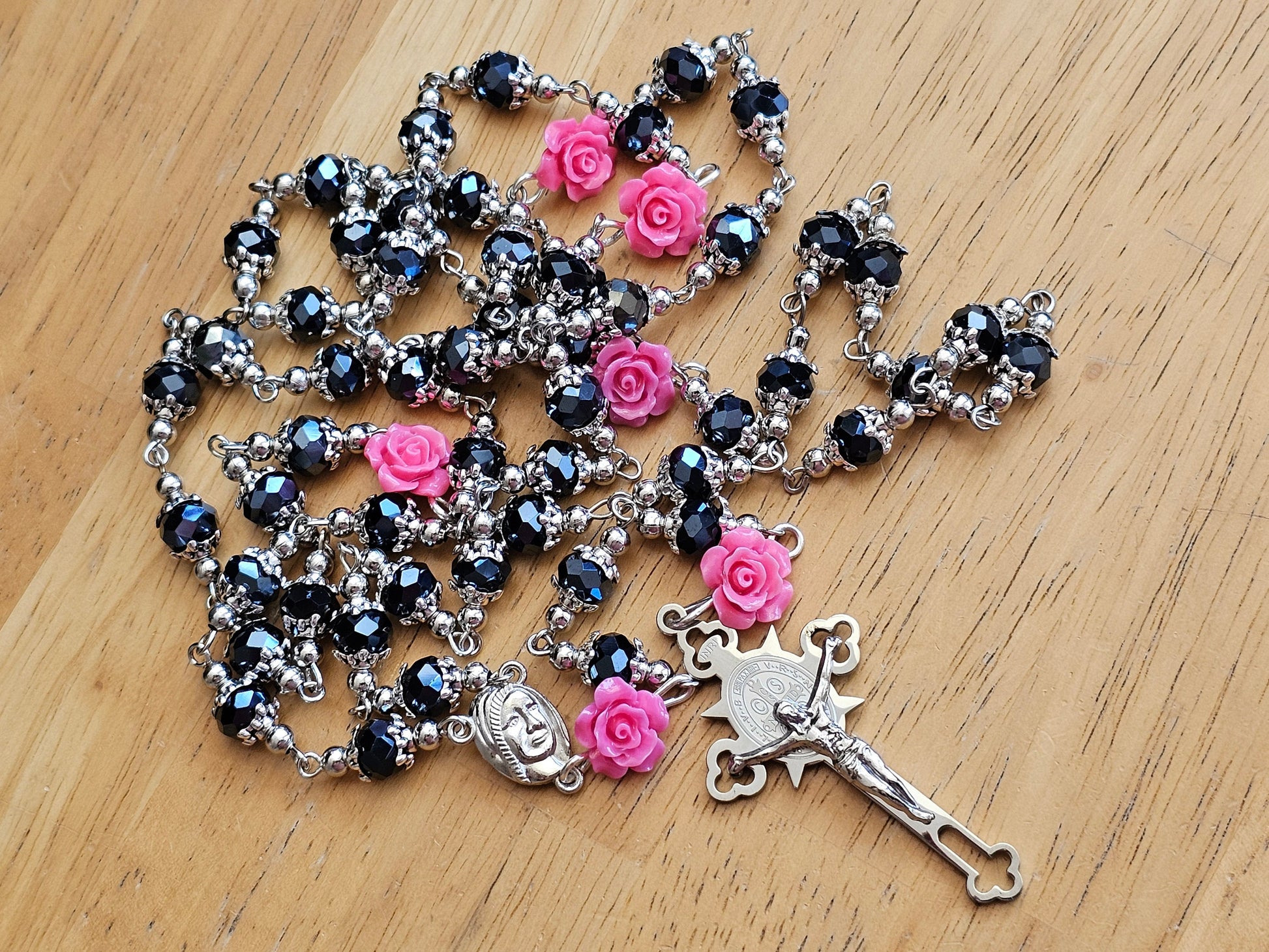 Gorgeous pink and black rosary with silver highlights and a stainless steel crucifix.