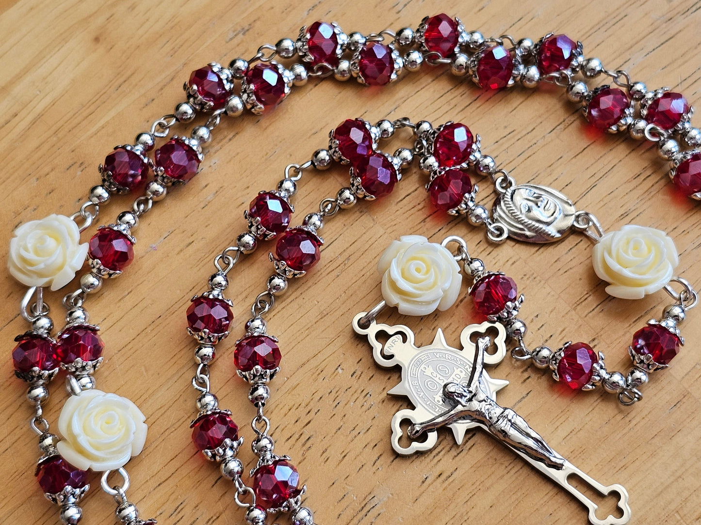 Detailed white roses red beads and silver hightlights.