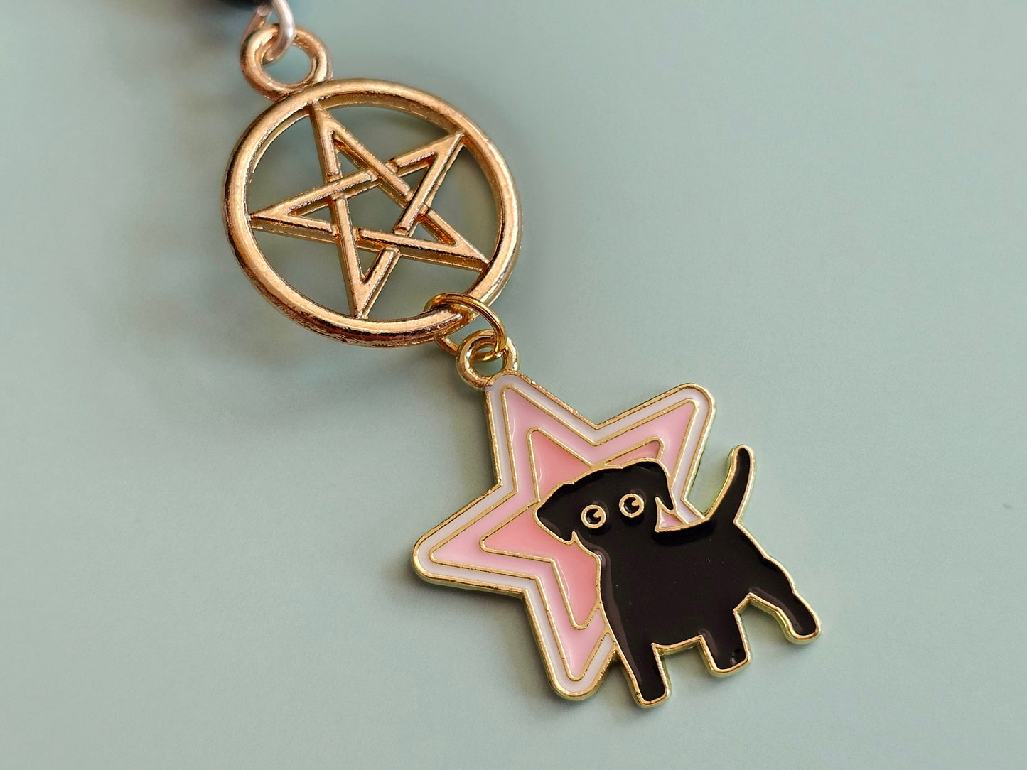 Dog pentagram keychain.