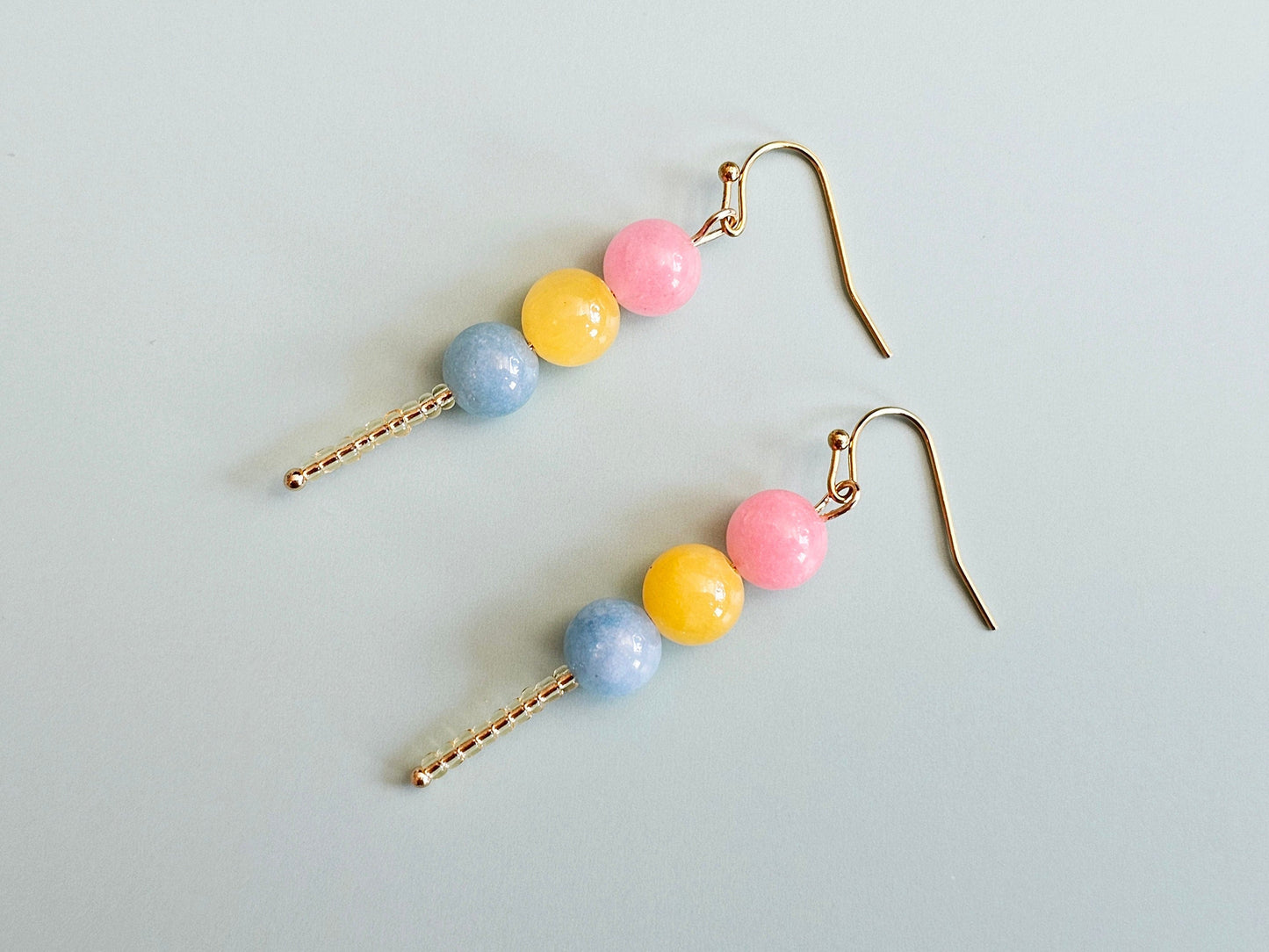 Pansexual gemstone earrings.