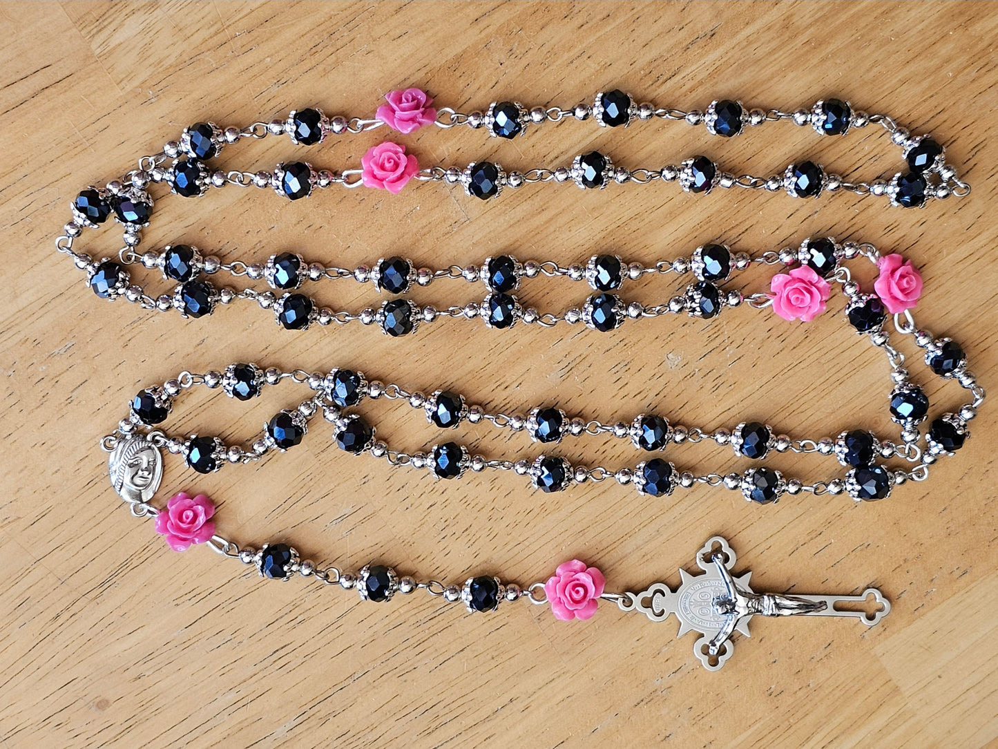 50 inch long black and pink rosary.