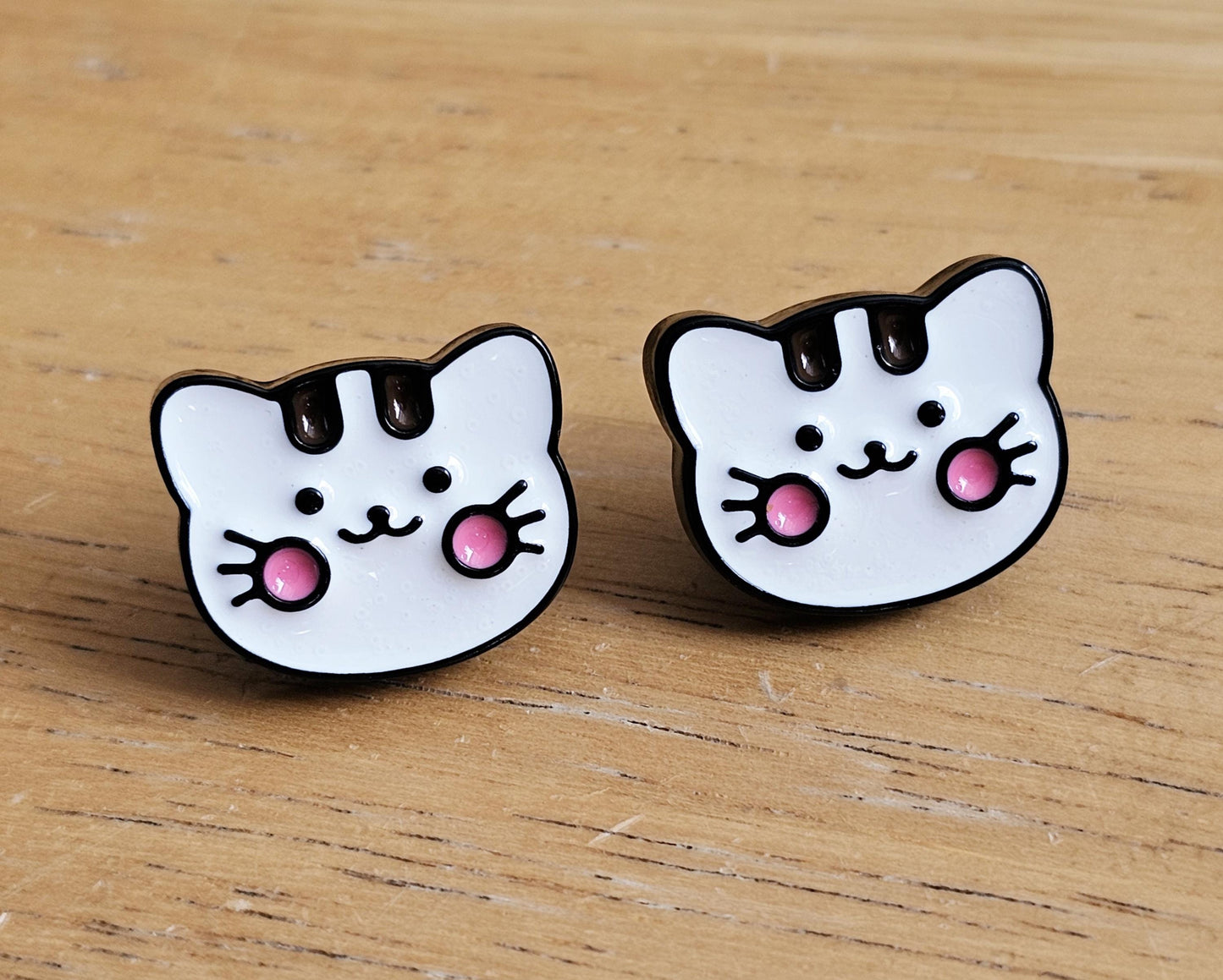 Cute cat studs with hypoallergenic ear posts surgical steel or titanium.