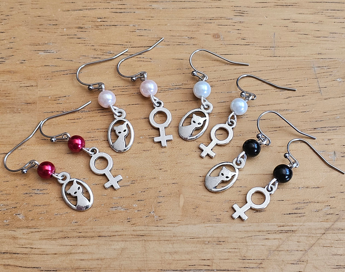 Dainty earrings with hypoallergenic titanium or surgical steel ear wires.