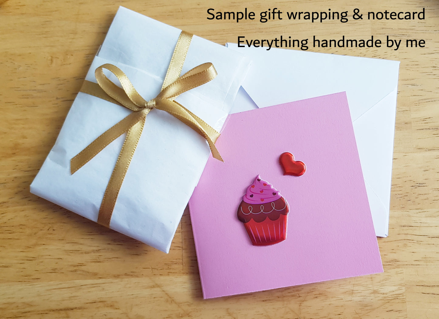 a gift wrapper and notecard with a cupcake on it