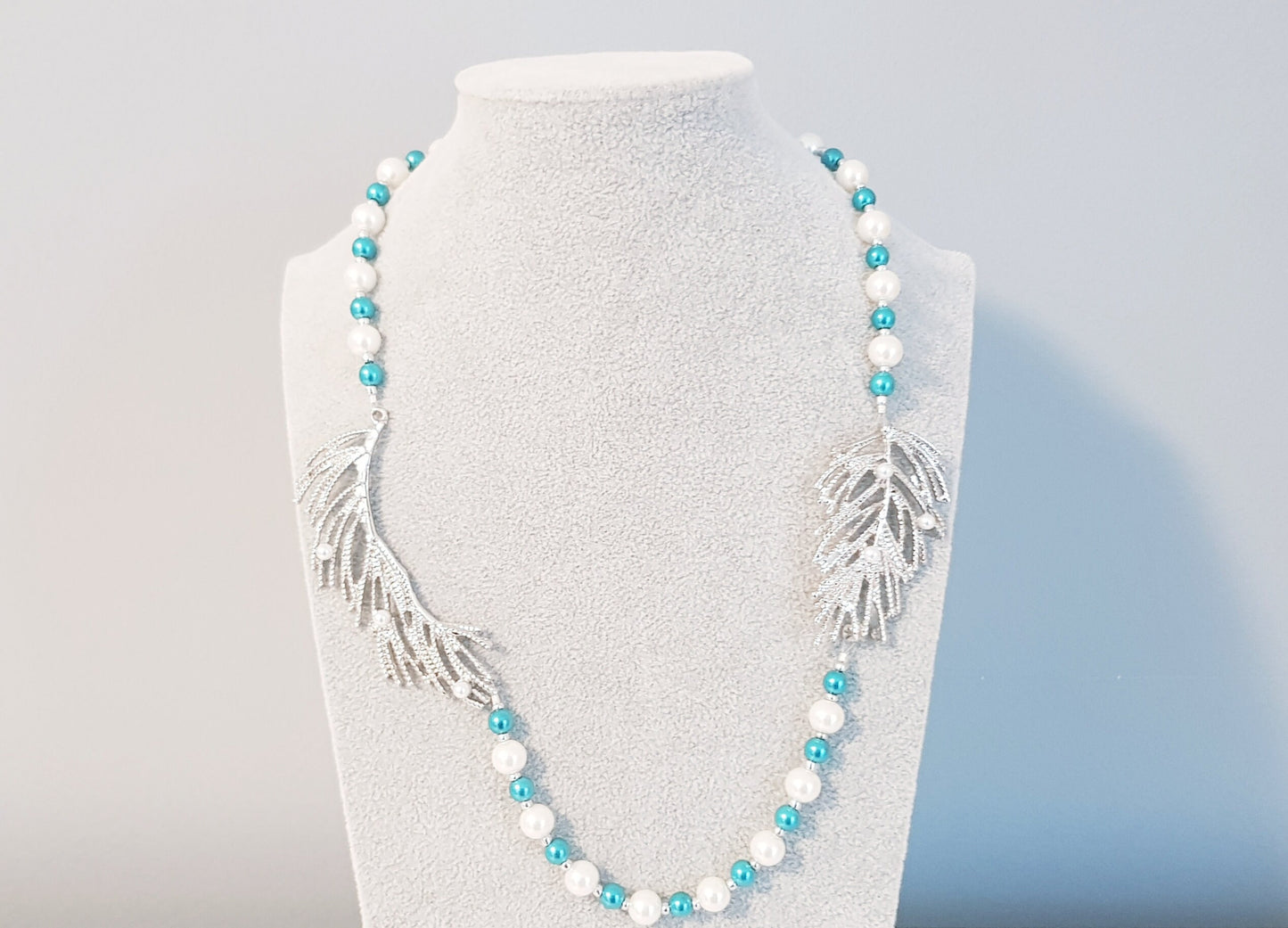 Silver, white and turquoise blue pearl necklace.