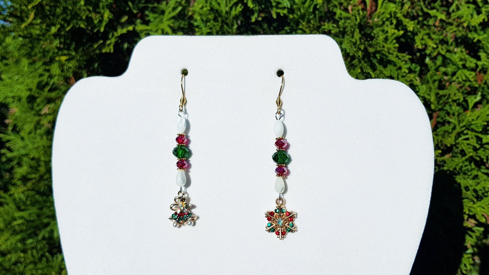 Snowflake and Christmas bell earrings.