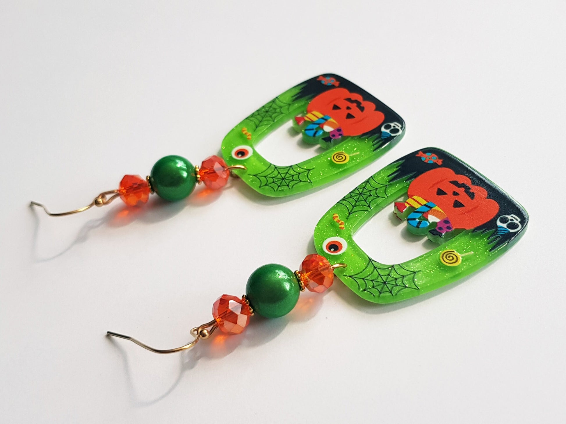 Green, orange and black earrings. Durable and lightweight.