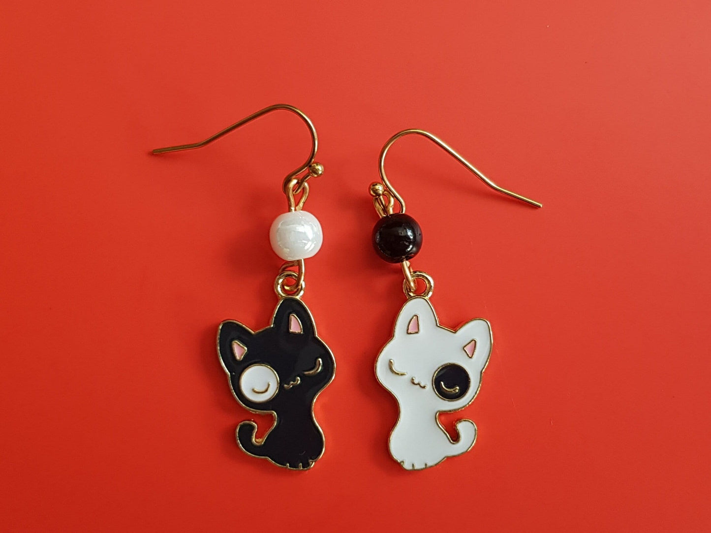 Black and white cat earrings. Mismatched earrings with hypoallergenic ear wires.