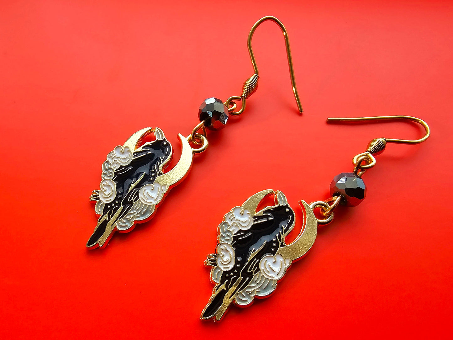 Crescent moon and cloud raven and crow earrings with hypoallergenic ear wires.