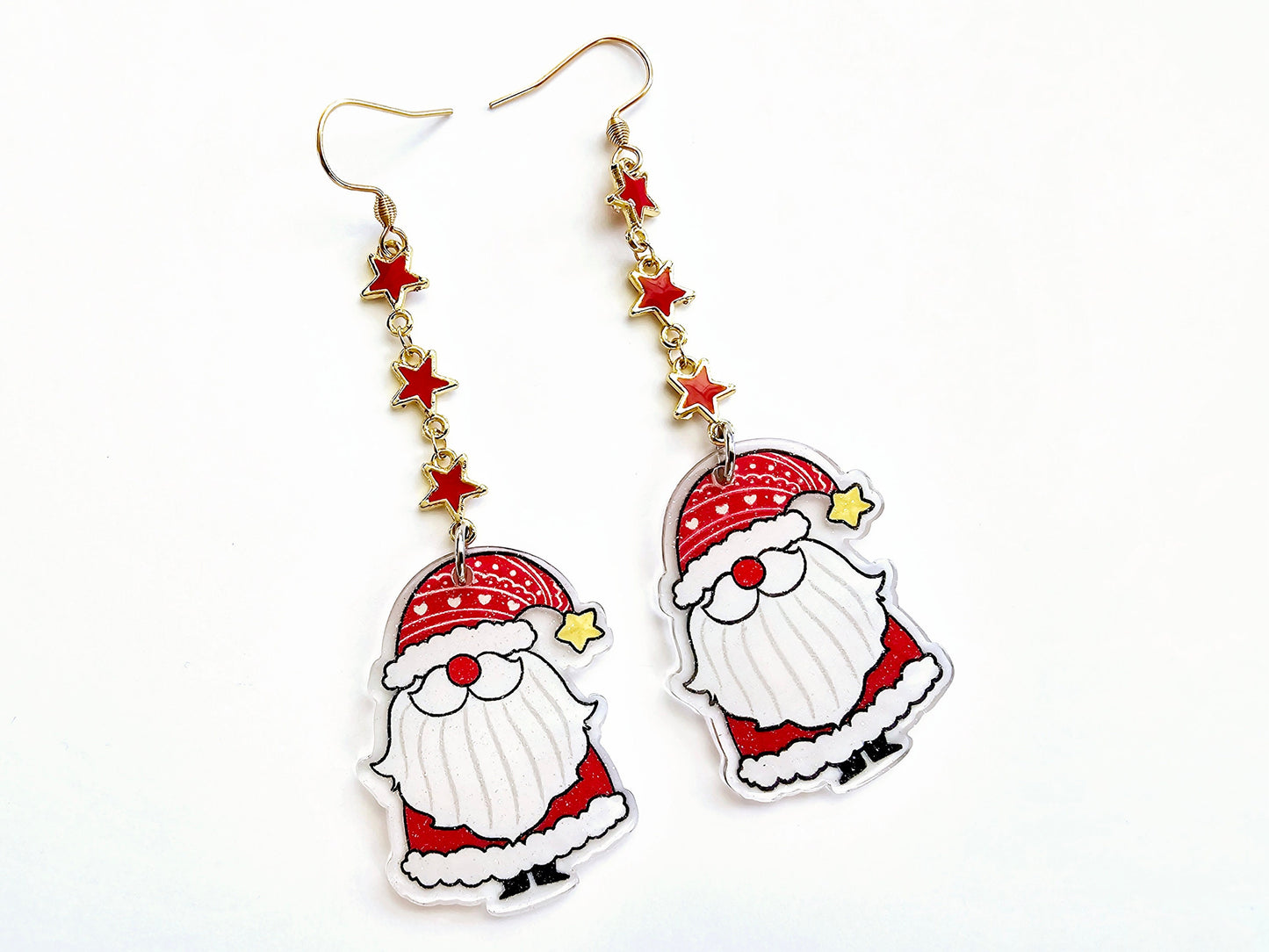 Santa Claus earrings with red stars and hypoallergenic titanium or surgical steel ear wires.