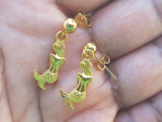 Dainty gold mermaid earrings.